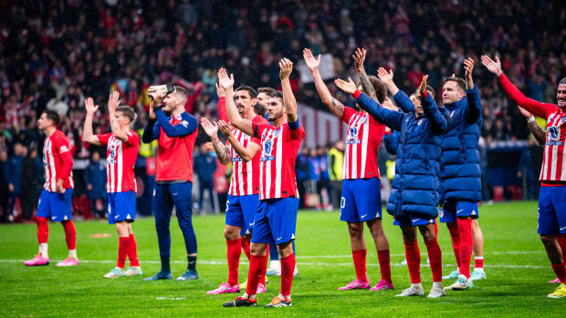 Atletico Madrid players pictured celebrating in front of their fans after beating Real Madrid 4-2 in the Copa del Rey in January 2024